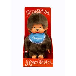 Sekiguchi 255040 - Original Monchhichi Junge, Plüschtier mit blauem Lätzchen und Zöpfen mit Schleifen, ca. 20 cm großes Kuscheltier aus braunem Plüsch, Braun