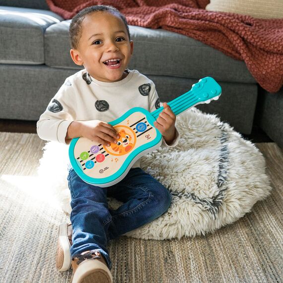 Baby Einstein 12609 Hape Sing & Strum Magic Touch Ukulele, Musikspielzeug aus Holz, mit 6 Melodien und 2 Tierstimmen, mehrfarbig