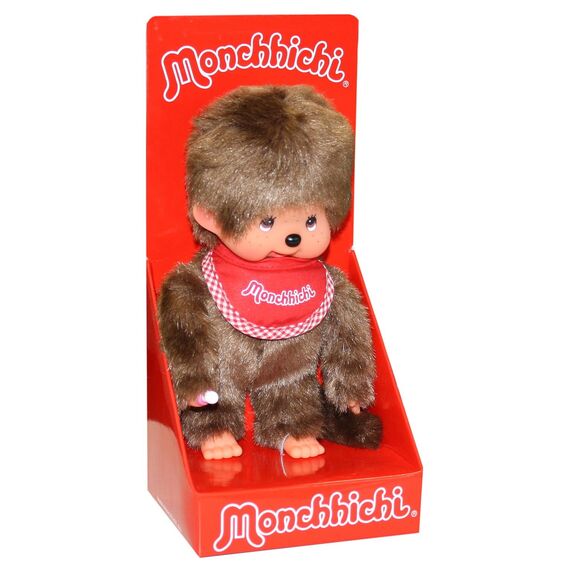 Sekiguchi 255010 - Original Monchhichi Junge, Plüschfigur mit rotem Latz und Zöpfen mit Schleifen, ca. 20 cm großes Kuscheltier aus braunem Plüsch