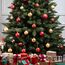 FAIRYTREES Weihnachtsbaum künstlich NORDMANNTANNE, grüner Stamm, Material PVC, inkl. Holzständer, 220cm