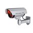 BASI | Kamera-Attrappe mit blinkendem LED-Licht | Dummy Kamera | Sicherheitskamera | Überwachungskamera für den Innen- und Außenbereich | Wandhalterung | drahtlos, Silber | CCTV