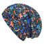 Wollhuhn Kinder Beanie – Zweilagige Longbeanie aus Jersey, wendbar & weich – innen grau – Handmade in Deutschland – ganzjährig (DE/NL/SE/PL, Numerisch, 48, 50, Blumen Schwarz/Bunt)